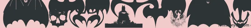 フォントBatmanEvolutionLogoFontG – ピンクの背景に黒い文字