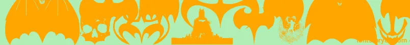 BatmanEvolutionLogoFontG Font – Orange Fonts on Green Background