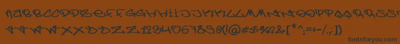 BerlinGraffiti-Schriftart – Schwarze Schriften auf braunem Hintergrund