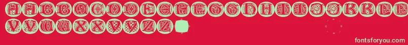 LombardicapsRound-Schriftart – Grüne Schriften auf rotem Hintergrund