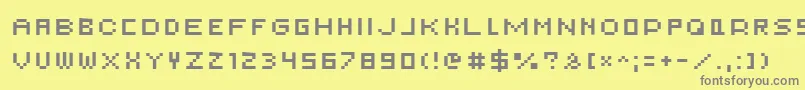 フォントAuxDotbitcSmallcaps – 黄色の背景に灰色の文字