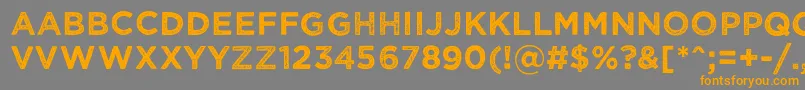 フォントWickedgrit – オレンジの文字は灰色の背景にあります。