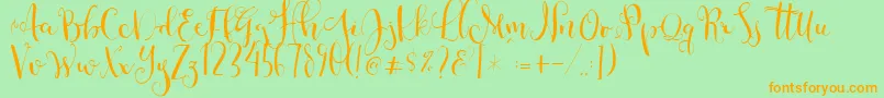 Cestlaisabellyalt-Schriftart – Orangefarbene Schriften auf grünem Hintergrund