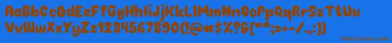 フォントChokoplain – 茶色の文字が青い背景にあります。