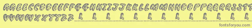 フォントThreadyBear – 黄色の背景に灰色の文字