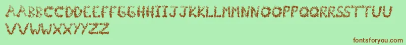 Fonte Popcornfont – fontes marrons em um fundo verde