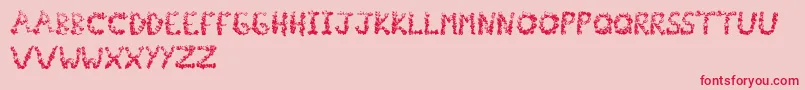 Popcornfont-Schriftart – Rote Schriften auf rosa Hintergrund