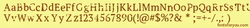 Creepshow Font – Brown Fonts on Yellow Background