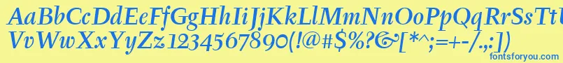 TyfamditcTtРљСѓСЂСЃРёРІ Font – Blue Fonts on Yellow Background