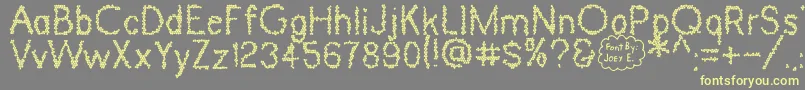 DinosaurSkin Font – Yellow Fonts on Gray Background