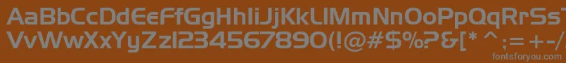 HandelGothicBt-fontti – harmaat kirjasimet ruskealla taustalla