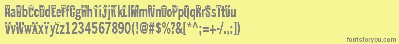 Kablokheadjam-fontti – harmaat kirjasimet keltaisella taustalla