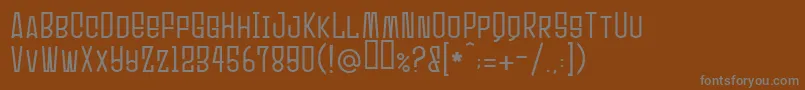 フォントUltrasonik – 茶色の背景に灰色の文字
