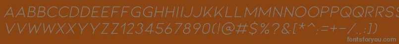 KionaItallic-Schriftart – Graue Schriften auf braunem Hintergrund