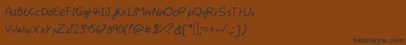 フォントRocchySHandwriting – 黒い文字が茶色の背景にあります