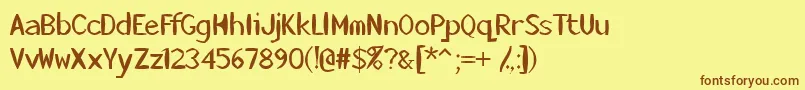フォントKillerstumps – 茶色の文字が黄色の背景にあります。