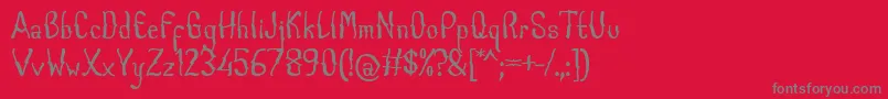 CabogeFontByOmus7ntypes-fontti – harmaat kirjasimet punaisella taustalla