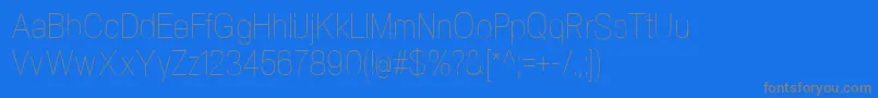 NeogramUltralightcnd-fontti – harmaat kirjasimet sinisellä taustalla