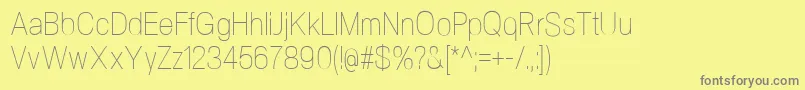 Шрифт NeogramUltralightcnd – серые шрифты на жёлтом фоне