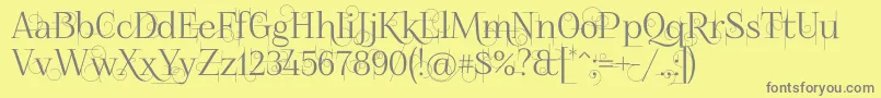 フォントFoglihtenno04070 – 黄色の背景に灰色の文字