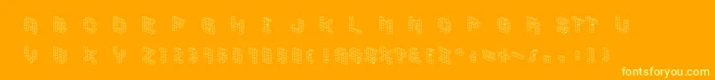 Fonte Demoncubicblockfont – fontes amarelas em um fundo laranja