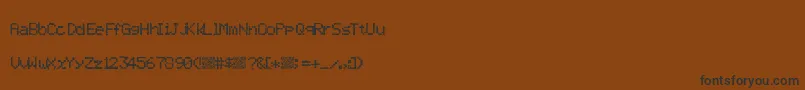 Czcionka Twistypixel – czarne czcionki na brązowym tle