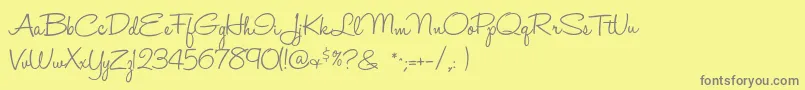 Fonte Halohandletter – fontes cinzas em um fundo amarelo