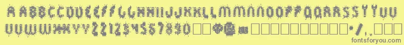 Fonte Sprckaren – fontes cinzas em um fundo amarelo