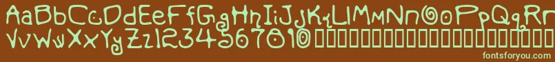 フォントMondoMessoFontoBold – 緑色の文字が茶色の背景にあります。