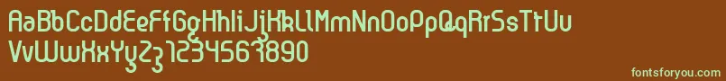 フォントKyma – 緑色の文字が茶色の背景にあります。