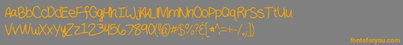 フォントHaeunmedium – オレンジの文字は灰色の背景にあります。