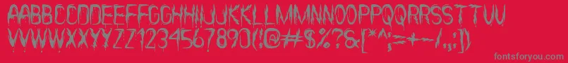 フォントItsScaryNowSt – 赤い背景に灰色の文字