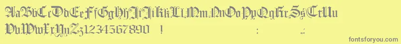Hollandmorlaeu-fontti – harmaat kirjasimet keltaisella taustalla