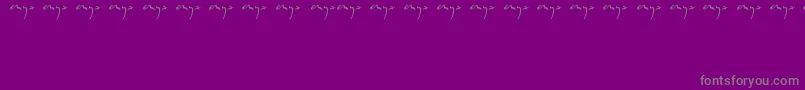 Enyalogo-fontti – harmaat kirjasimet violetilla taustalla
