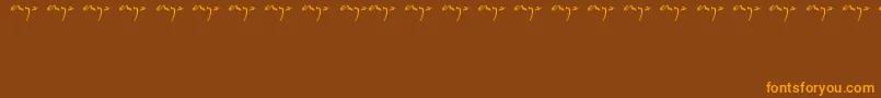 Enyalogo Font – Orange Fonts on Brown Background
