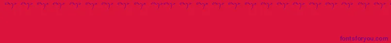 Czcionka Enyalogo – fioletowe czcionki na czerwonym tle