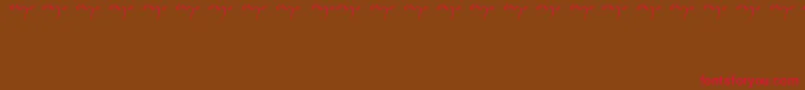Czcionka Enyalogo – czerwone czcionki na brązowym tle