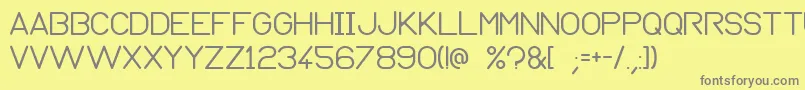Normograph-Schriftart – Graue Schriften auf gelbem Hintergrund