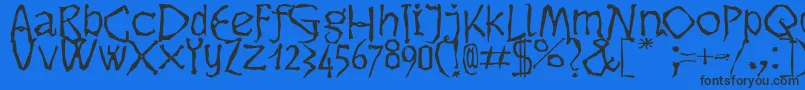 Czcionka Dikovina – czarne czcionki na niebieskim tle