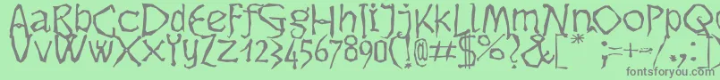 Dikovina Font – Gray Fonts on Green Background