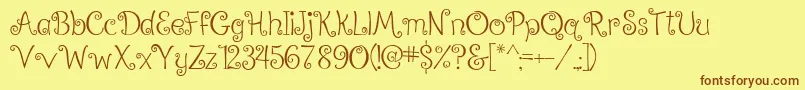 フォントRalphieBrownRegular – 茶色の文字が黄色の背景にあります。