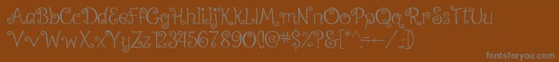RalphieBrownRegular-fontti – harmaat kirjasimet ruskealla taustalla