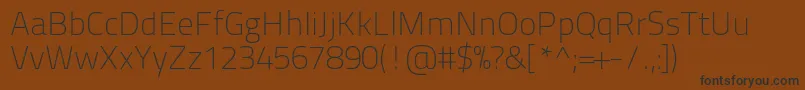 Titilliumtext22l1wt-fontti – mustat fontit ruskealla taustalla