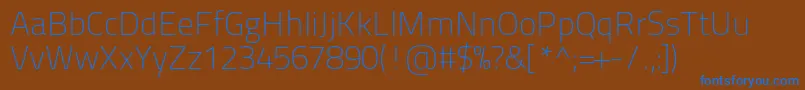 Titilliumtext22l1wt-fontti – siniset fontit ruskealla taustalla