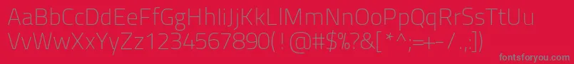 Titilliumtext22l1wt-Schriftart – Graue Schriften auf rotem Hintergrund