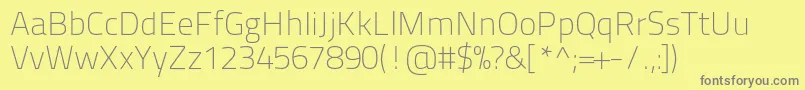 Titilliumtext22l1wt-fontti – harmaat kirjasimet keltaisella taustalla