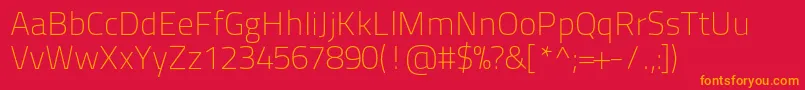Titilliumtext22l1wt-Schriftart – Orangefarbene Schriften auf rotem Hintergrund