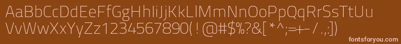 Titilliumtext22l1wt-fontti – vaaleanpunaiset fontit ruskealla taustalla