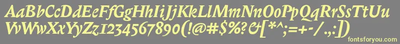 BiblonitcBolditalic-fontti – keltaiset fontit harmaalla taustalla