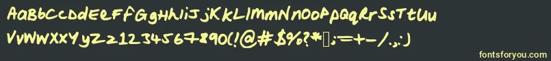 フォントWoodsscript – 黒い背景に黄色の文字